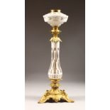 A VICTORIAN ORMOLU AND BOHEMIAN GLASS OIL LAMP BASE. 21ins high.