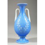 A BLUE "DOLCE RELIVO" OPAQUE GLASS TWIN-HANDLED BALUSTER VASE, with incised floral decoration. 10ins