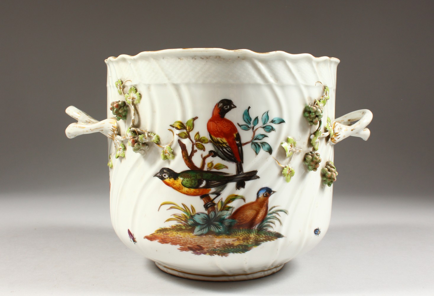 A DRESDEN AUGUSTUS REX CIRCULAR TWO-HANDLED JARDINIERE, encrusted with fruiting vines and painted