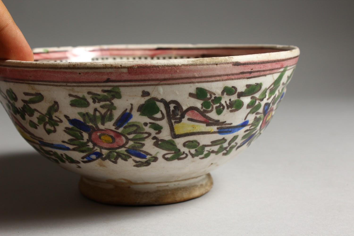 AN EARLY ISLAMIC POTTERY CIRCULAR BOWL, painted with birds. 7.5ins diameter. - Image 3 of 7
