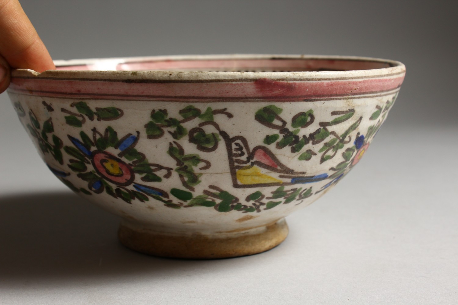 AN EARLY ISLAMIC POTTERY CIRCULAR BOWL, painted with birds. 7.5ins diameter. - Image 2 of 7