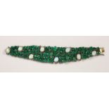 A HIGHLY DECORATIVE EMERALD AND MOONSTONE OPENWORK BRACELET. 7ins long.