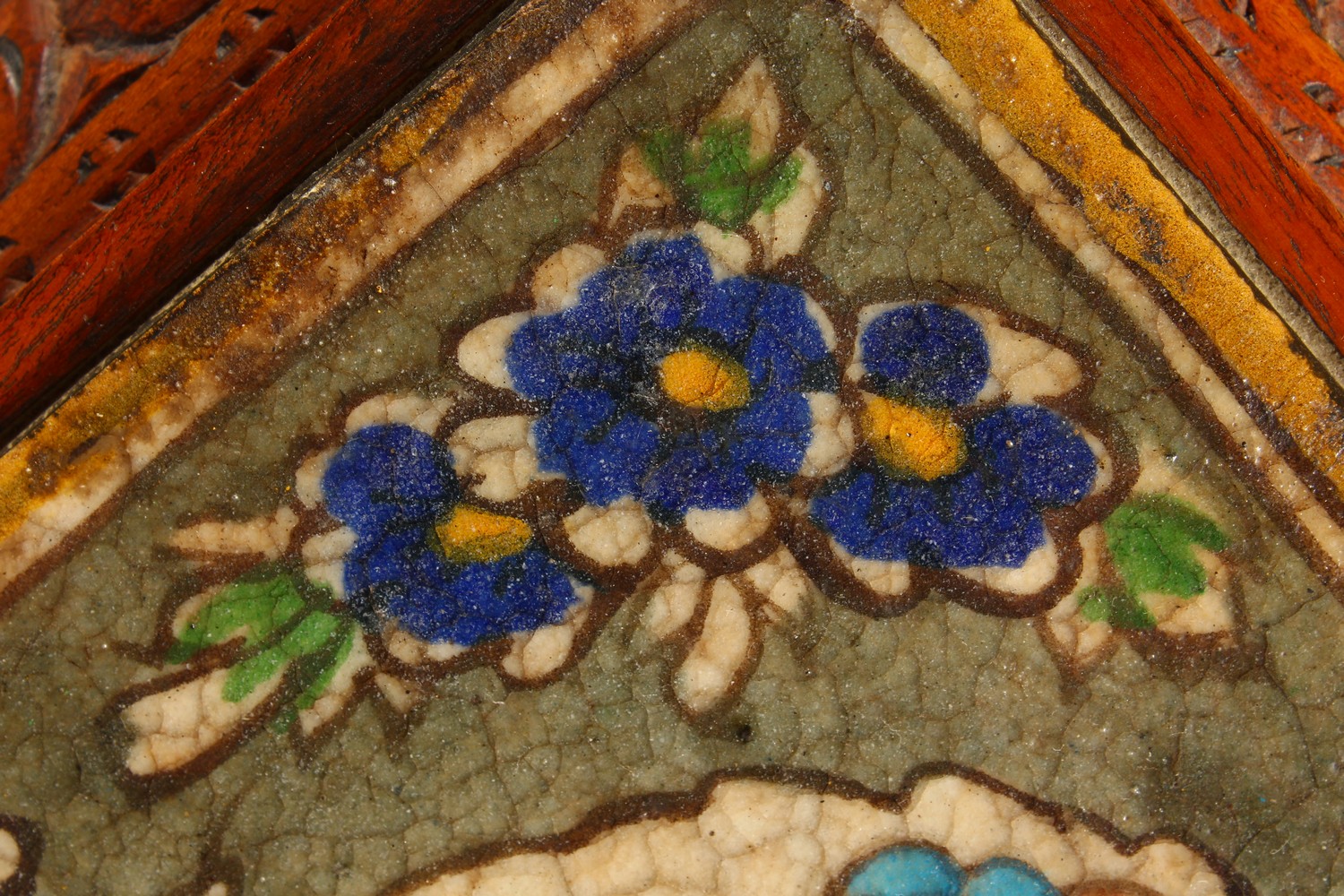 AN ISLAMIC POTTERY TILE, painted with a bust within a floral border, mounted in a later carved - Image 4 of 8