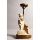 AN ALABASTER TABLE LAMP, modelled as a young girl stood on a flight of steps. 18ins high including