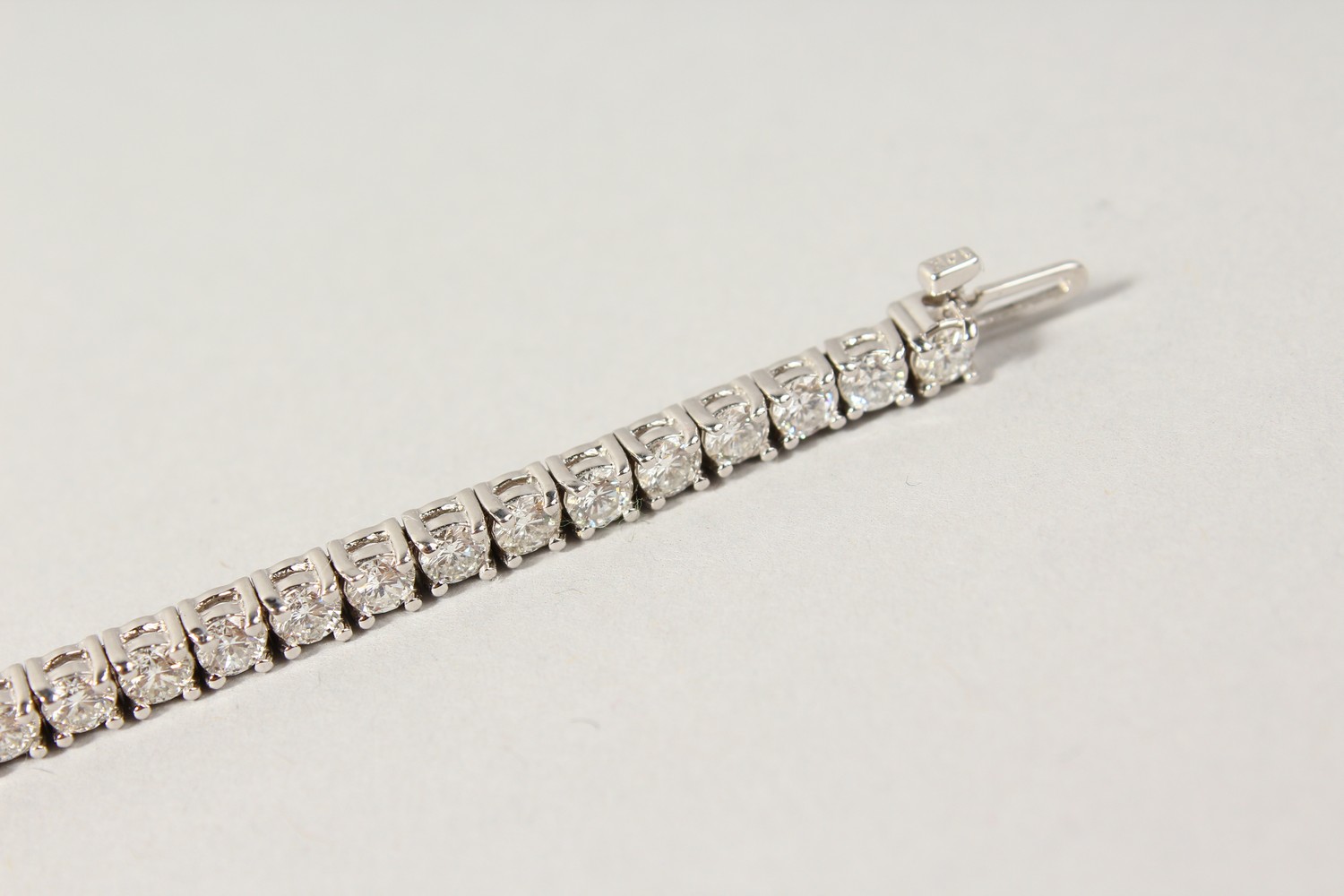 AN 18CT WHITE GOLD DIAMOND LINE BRACELET, with forty-nine diamonds, approx. 6CTS, G/H Colour, V1- - Image 10 of 19