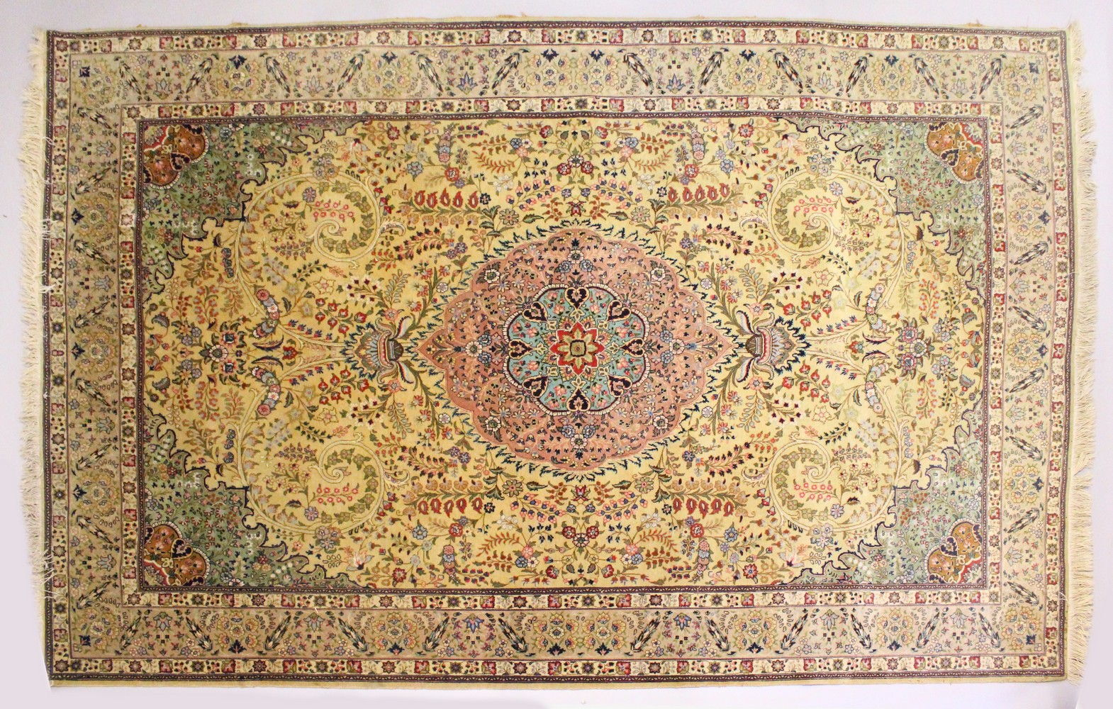 A GOOD PERSIAN CARPET, 20TH CENTURY, beige ground with central floral panel within a similar border.