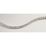 AN 18CT WHITE GOLD DIAMOND LINE BRACELET, with forty-nine diamonds, approx. 6CTS, G/H Colour, V1-