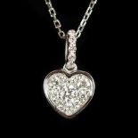 AN 18CT WHITE GOLD HEART SHAPED DIAMOND SET PENDANT AND CHAIN.