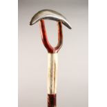 A THUMB STICK, with horn handle. 51.5ins long.