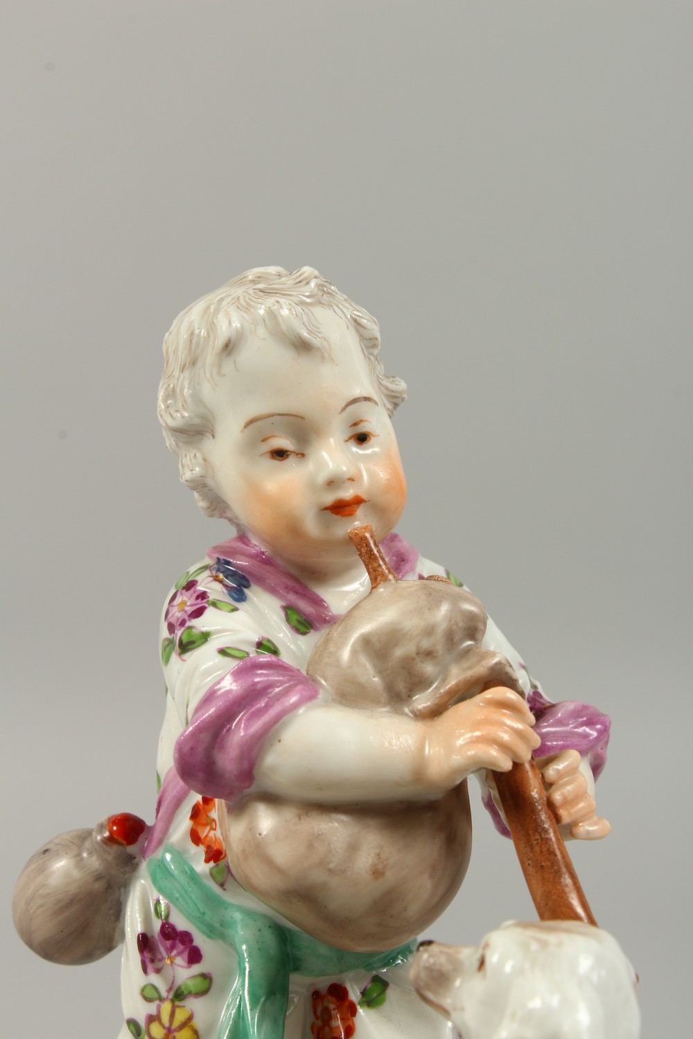 A VIENNA PORCELAIN GROUP OF A YOUNG BOY PLAYING A BAGPIPE, a dog on its hind legs and a sheep by his - Image 2 of 10