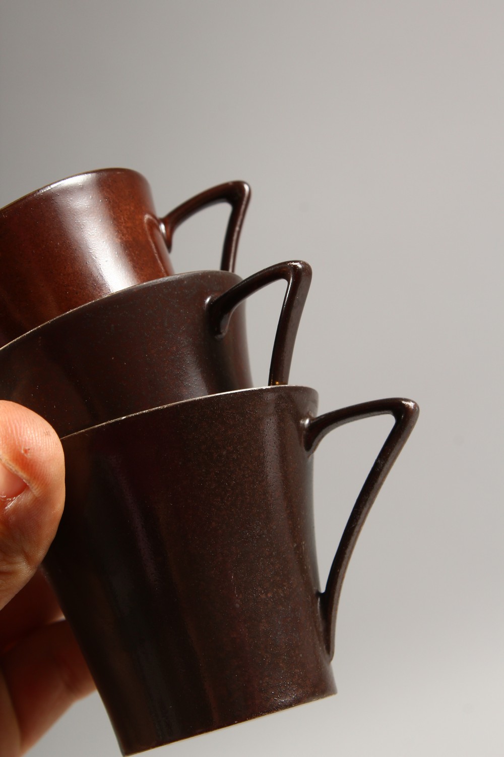 A LIMOGES PORCELAIN PART COFFEE SERVICE, brown glazed, comprising coffee pot, sucrier, eight cups - Image 12 of 15