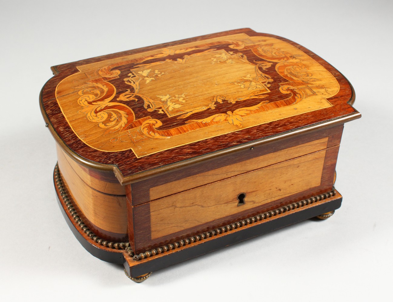 A GOOD 19TH CENTURY FRENCH INLAID JEWELLERY BOX by MILLELOT à PARIS, with crossbanded shaped top,