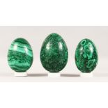 THREE LARGE MALACHITE EGGS. 7ins, 6.5ins and 6.25ins.