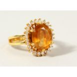 AN 18CT GOLD, DIAMOND AND CITRINE RING.