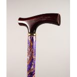 A LADIES COLOURFUL WALKING STICK. 35ins long.