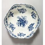 A LARGE WORCESTER BLUE AND WHITE SHELL MOULDED BOWL, decorated with vegetables, butterflies, fruit