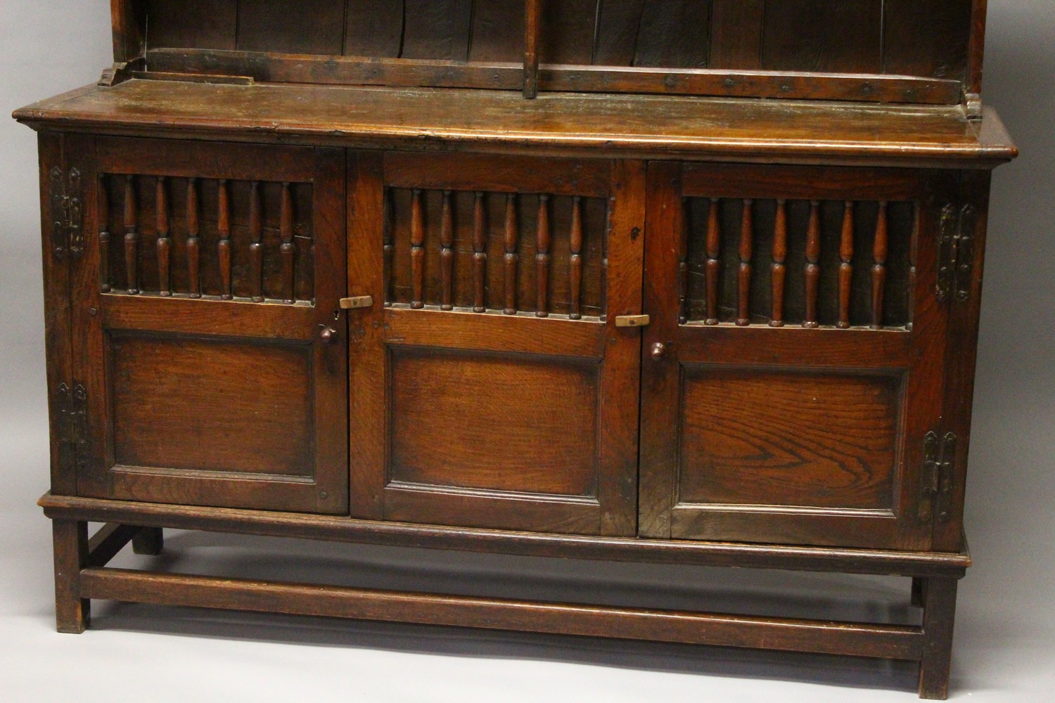 AN 18TH CENTURY OAK DRESSER, with a double Delft rack, the base with three cupboard doors, each part - Image 6 of 6