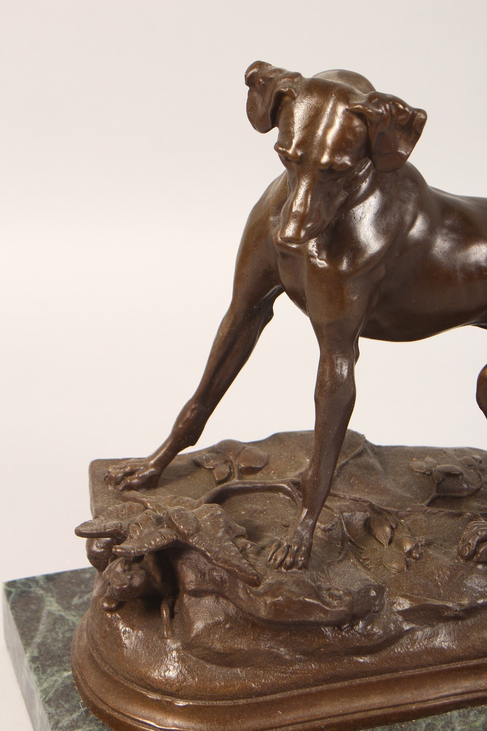 AN AMUSING BRONZE OF A DOG CHASING A RABBIT DOWN A RABBIT HOLE, on a rectangular marble base. 11. - Image 2 of 3