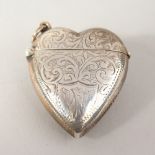 A SILVER HEART SHAPED VESTA.