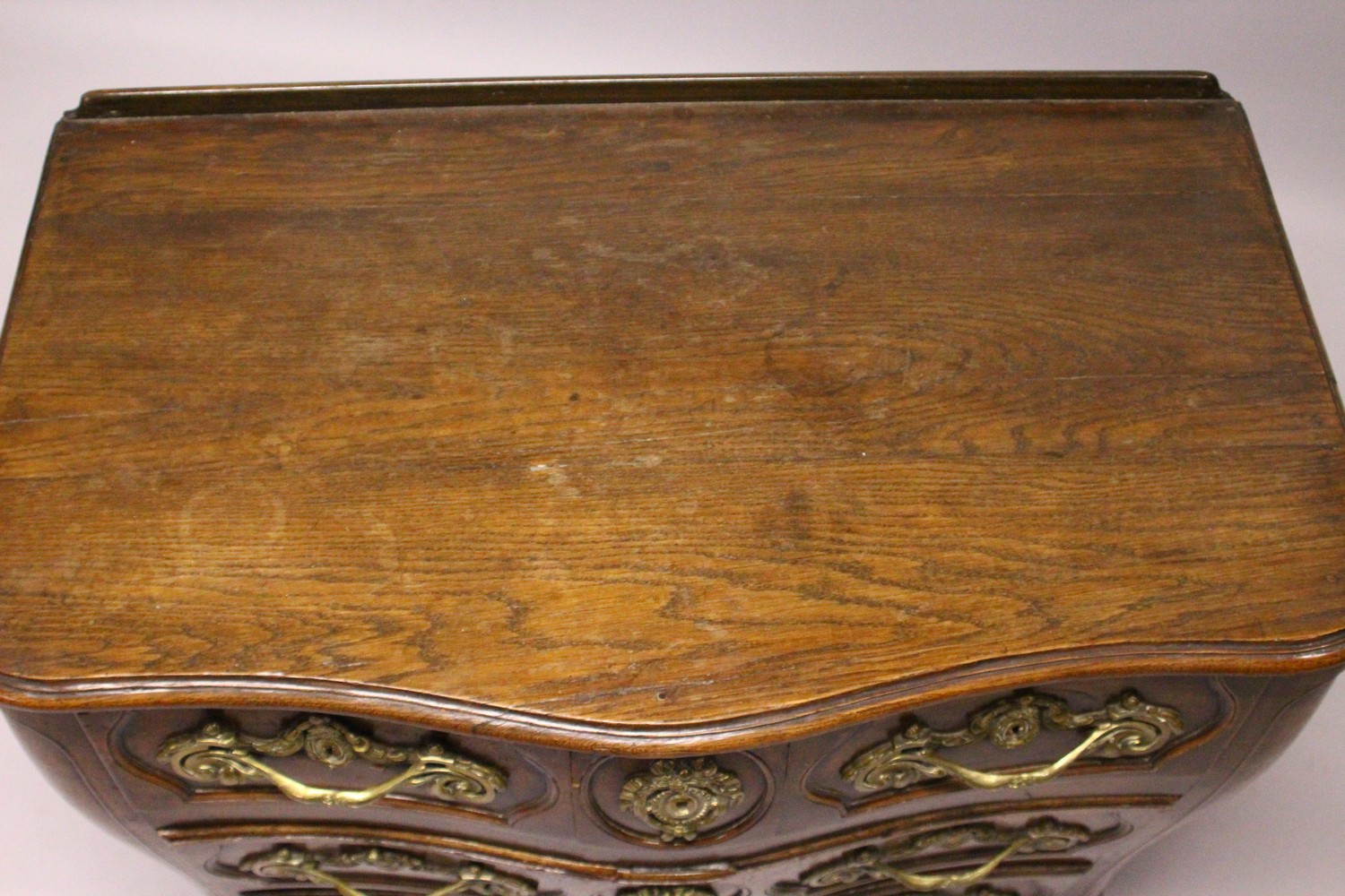 A LOUIS XV STYLE FRENCH OAK SERPENTINE FRONT COMMODE, comprising two short and two long drawers, all - Image 2 of 14
