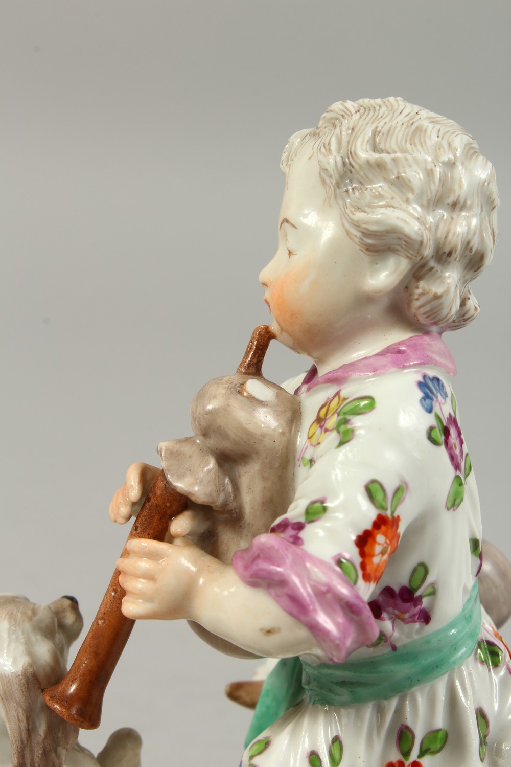 A VIENNA PORCELAIN GROUP OF A YOUNG BOY PLAYING A BAGPIPE, a dog on its hind legs and a sheep by his - Image 6 of 10