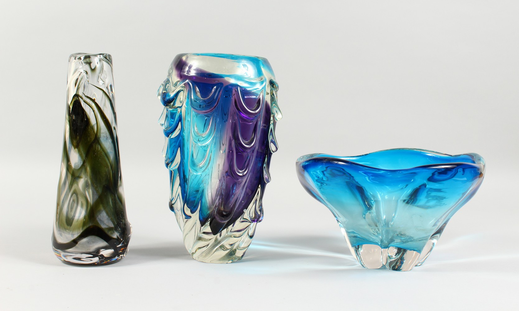 THREE PIECES OF HEAVY MOULDED GLASSWARE, comprising two vases and a bowl (3).