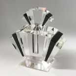 A LARGE CLEAR AND BLACK GLASS ART DECO STYLE SCENT BOTTLE. 9ins high.