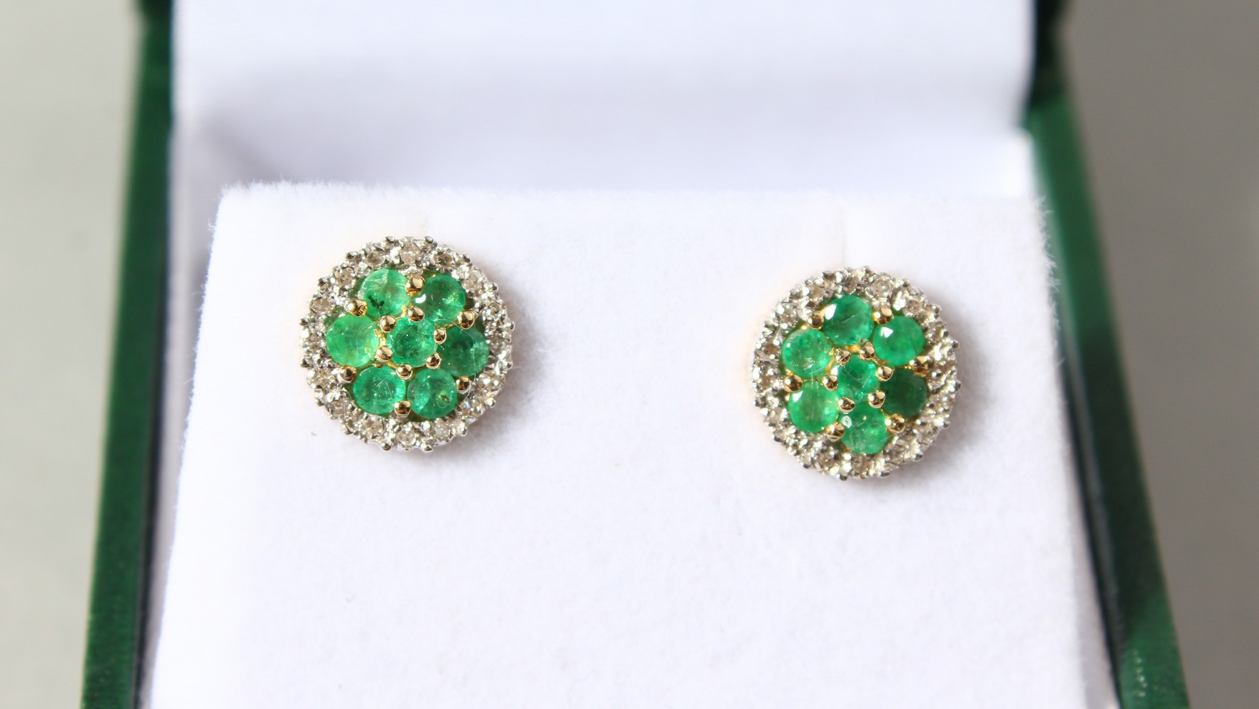 A PAIR OF 9CT GOLD, DIAMOND AND EMERALD CLUSTER EARRINGS.