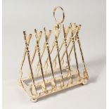 A SIX-DIVISION TOAST RACK, modelled as crossed oars.