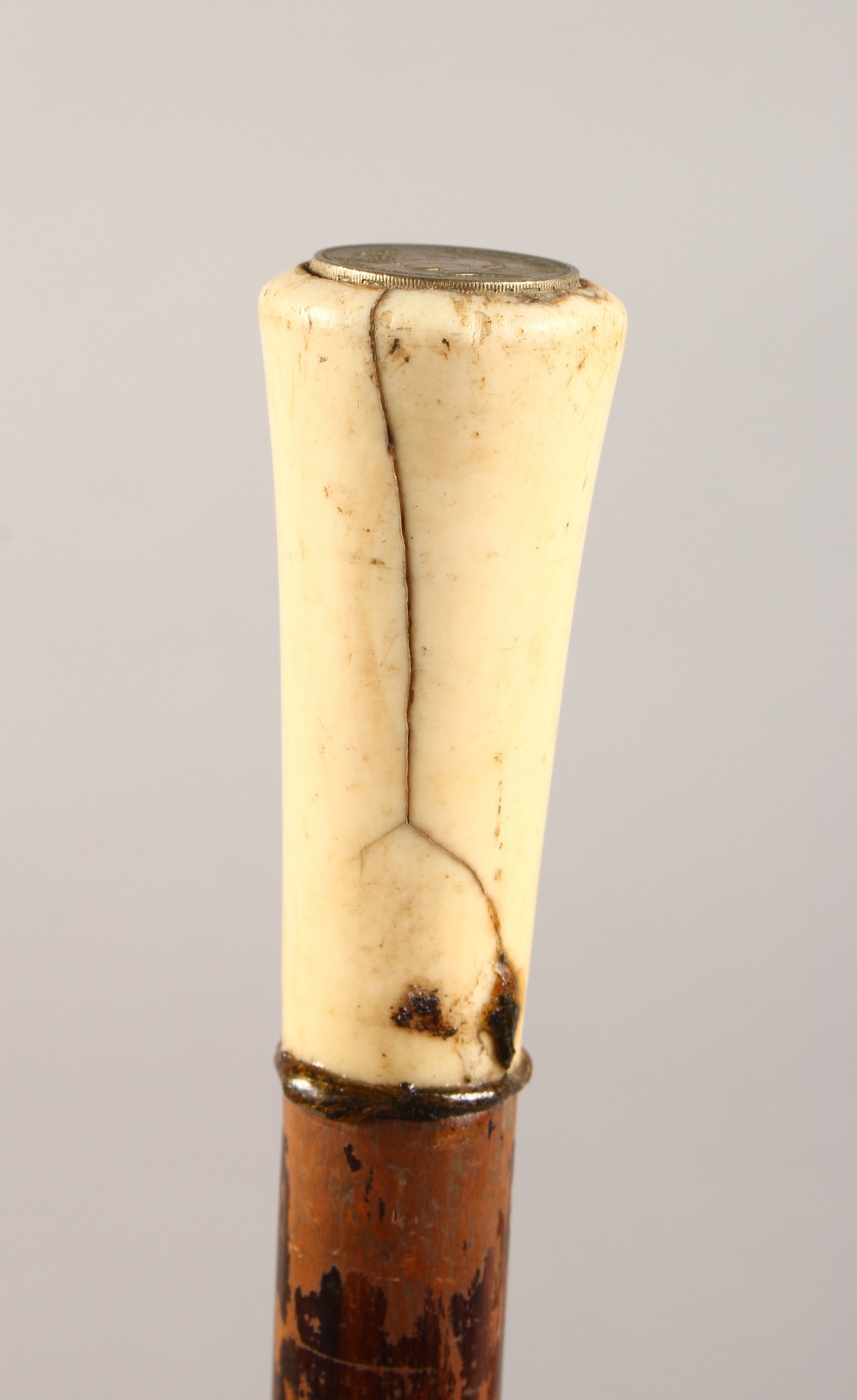 AN IVORY HANDLED WALKING STICK. 35ins long.