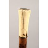 AN IVORY HANDLED WALKING STICK. 35ins long.