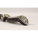 AN EBONISED CARVED WOOD SNAKE SHAPED WALKING STICK, with mother-of-pearl inlay. 36.5ins long.