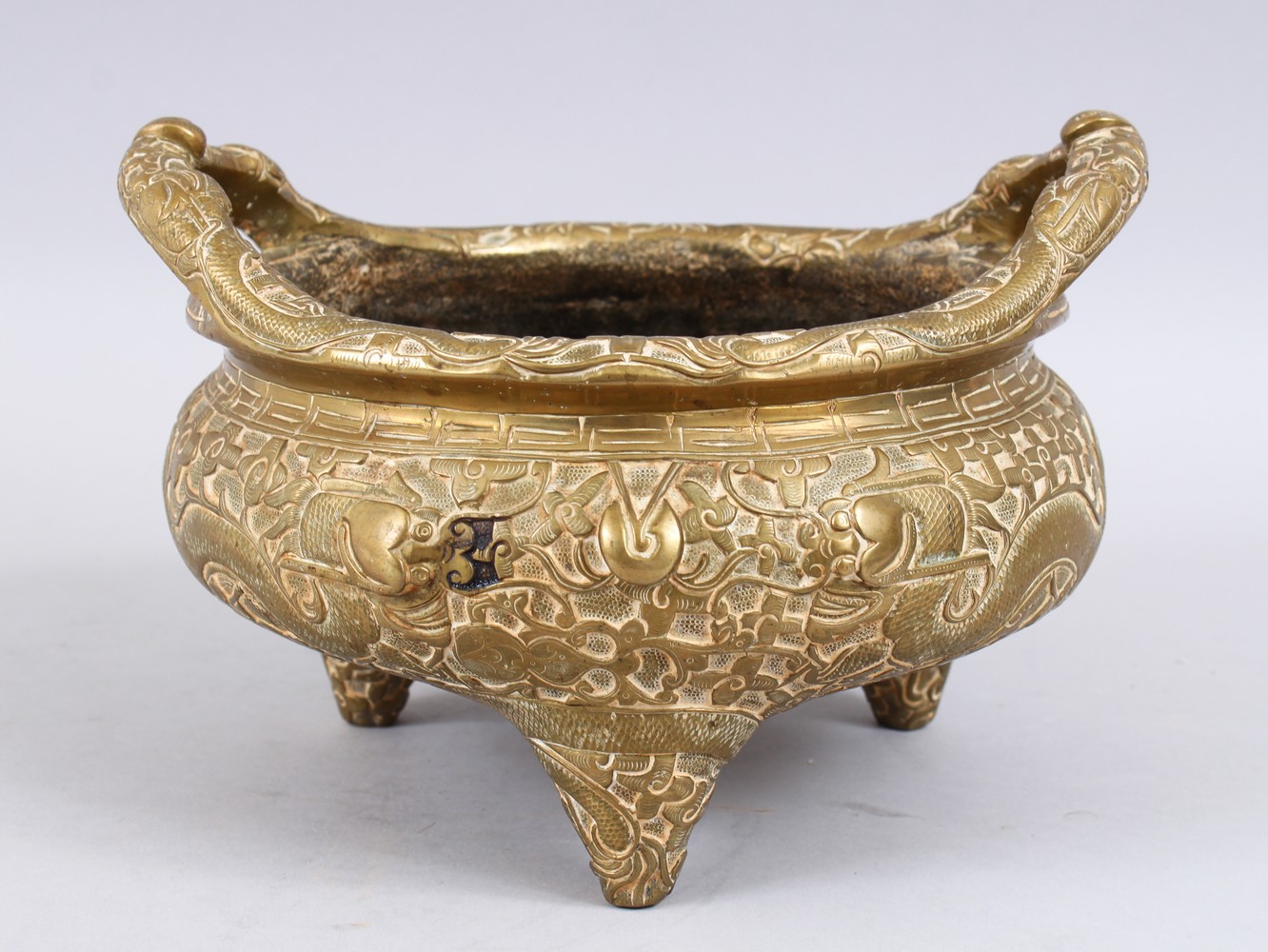 A HEAVY 20TH CENTURY CHINESE BRONZE TRIPOD CENSER, the body with chilongs, the base with a six