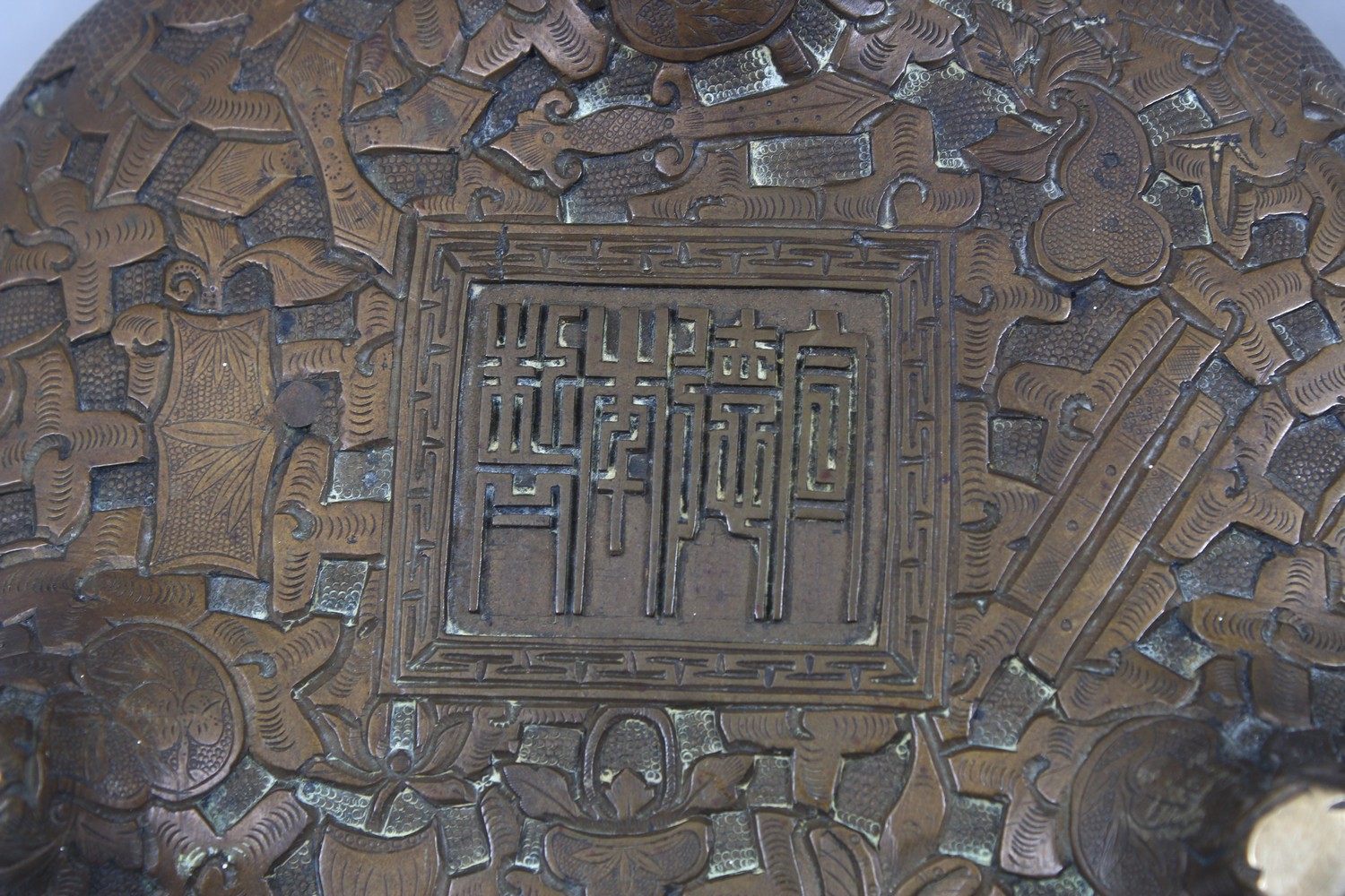 TWO GOOD CHINESE BRONZE TRIPOD CENSERS, Both with deep carved scenes of chilongs and archaic design, - Image 8 of 9