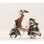 AN ALUMINIUM AND LEATHER MODEL OF A MOPED. 11ins long.