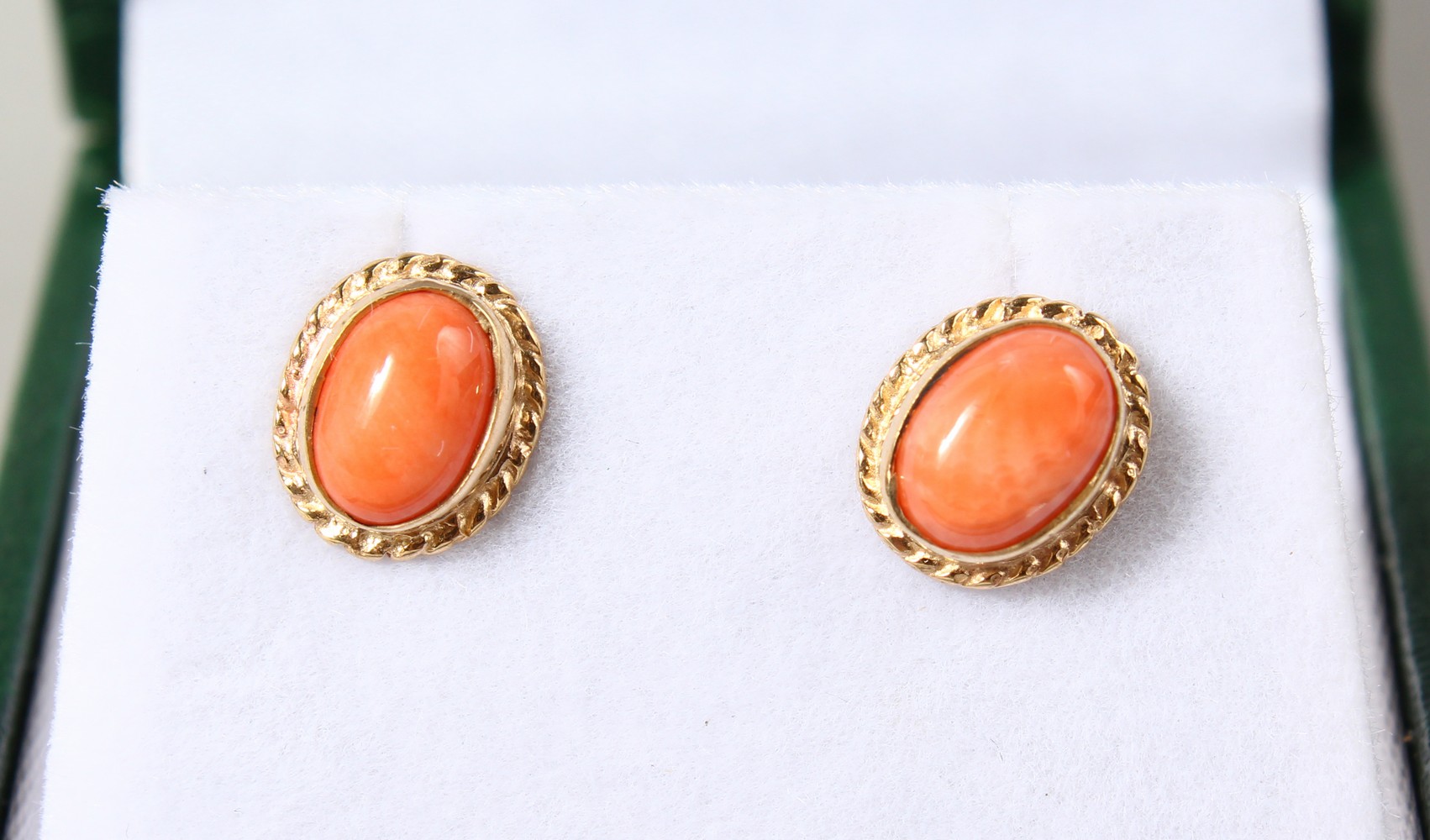 A PAIR OF 9CT GOLD ROUND CORAL EARRINGS.