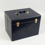 A BLUE LEATHER VANITY CASE.