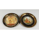 TWO VICTORIAN CIRCULAR PAPIER MACHE TRAYS, decorated with a church exterior and interior. 12ins