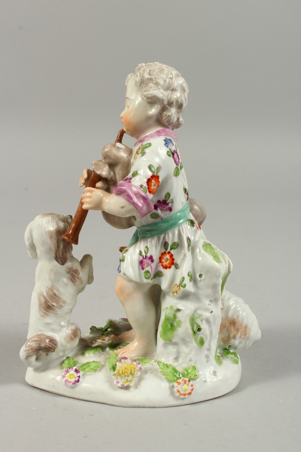 A VIENNA PORCELAIN GROUP OF A YOUNG BOY PLAYING A BAGPIPE, a dog on its hind legs and a sheep by his - Image 5 of 10