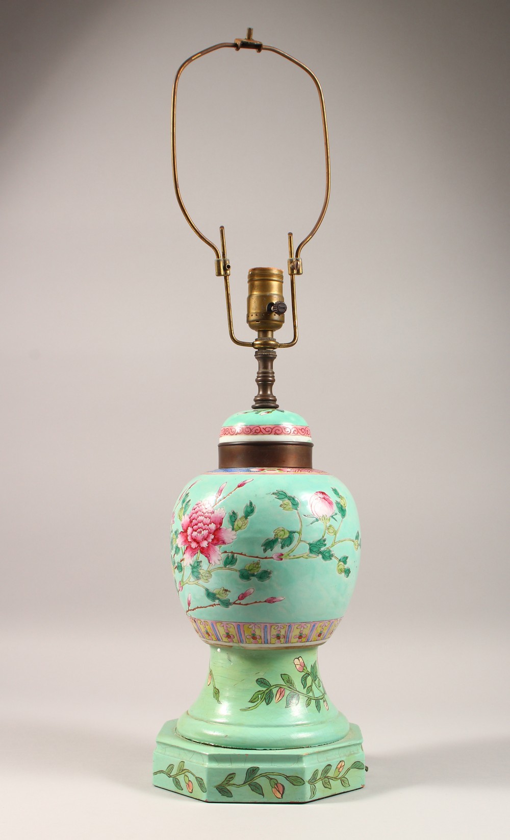 A CHINESE TURQUOISE GROUND GINGER JAR AND COVER, on later wooden base, converted to a lamp. 18ins