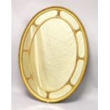 A LATE 19TH CENTURY ADAM REVIVAL GILT FRAMED OVAL WALL MIRROR, with gadroon carved frame. 3ft 8.5ins