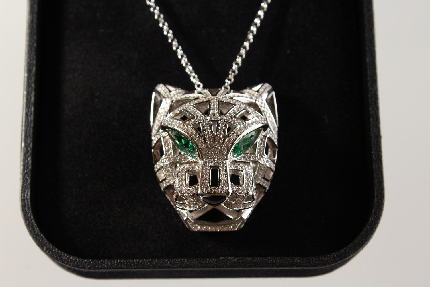 A CARTIER DESIGN SILVER PANTHER PENDANT ON CHAIN. - Image 2 of 3