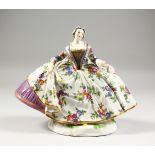 A GOOD LARGE MEISSEN FIGURE OF A LADY, wearing a floral skirt with purple underskirt, a folded fan