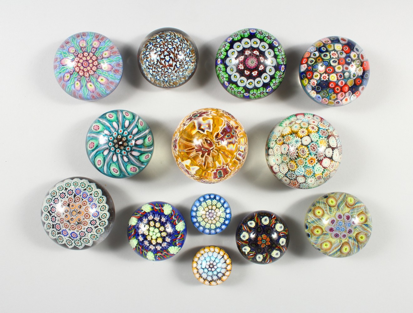 A COLLECTION OF THIRTEEN MILLEFIORI PAPERWEIGHTS. 3ins diameter and smaller.