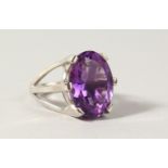 A SILVER LARGE AMETHYST SET RING.