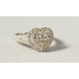 A GOOD 18CT WHITE GOLD DIAMOND HEART SHAPED CLUSTER RING.