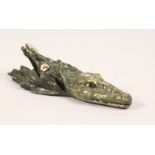 A COLD PAINTED BRONZE PAPER CLIP, modelled as an alligator. 5.5ins long.