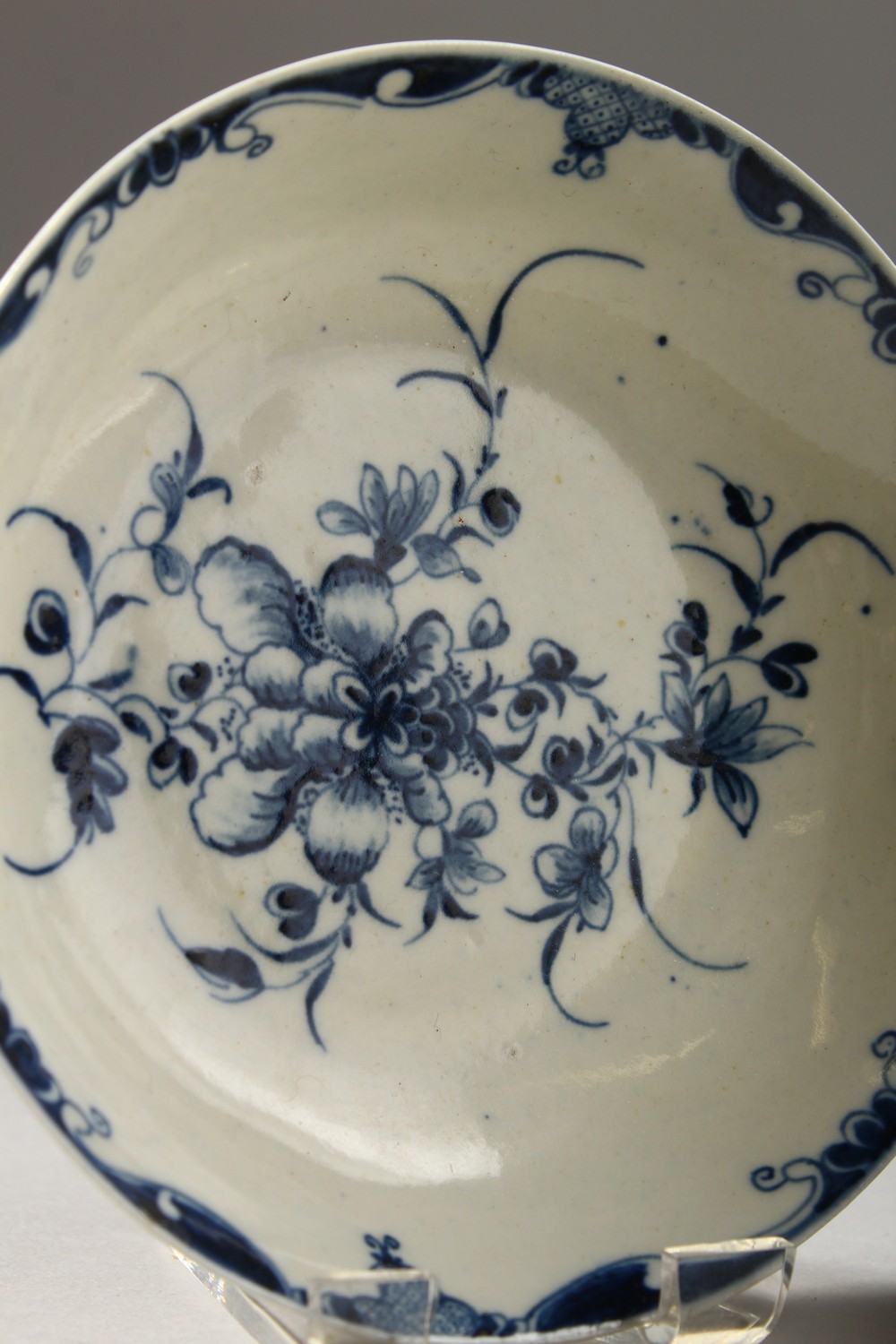 A WORCESTER BLUE AND WHITE TEA BOWL AND SAUCER, painted with large trailing flowers, the saucer with - Image 2 of 10