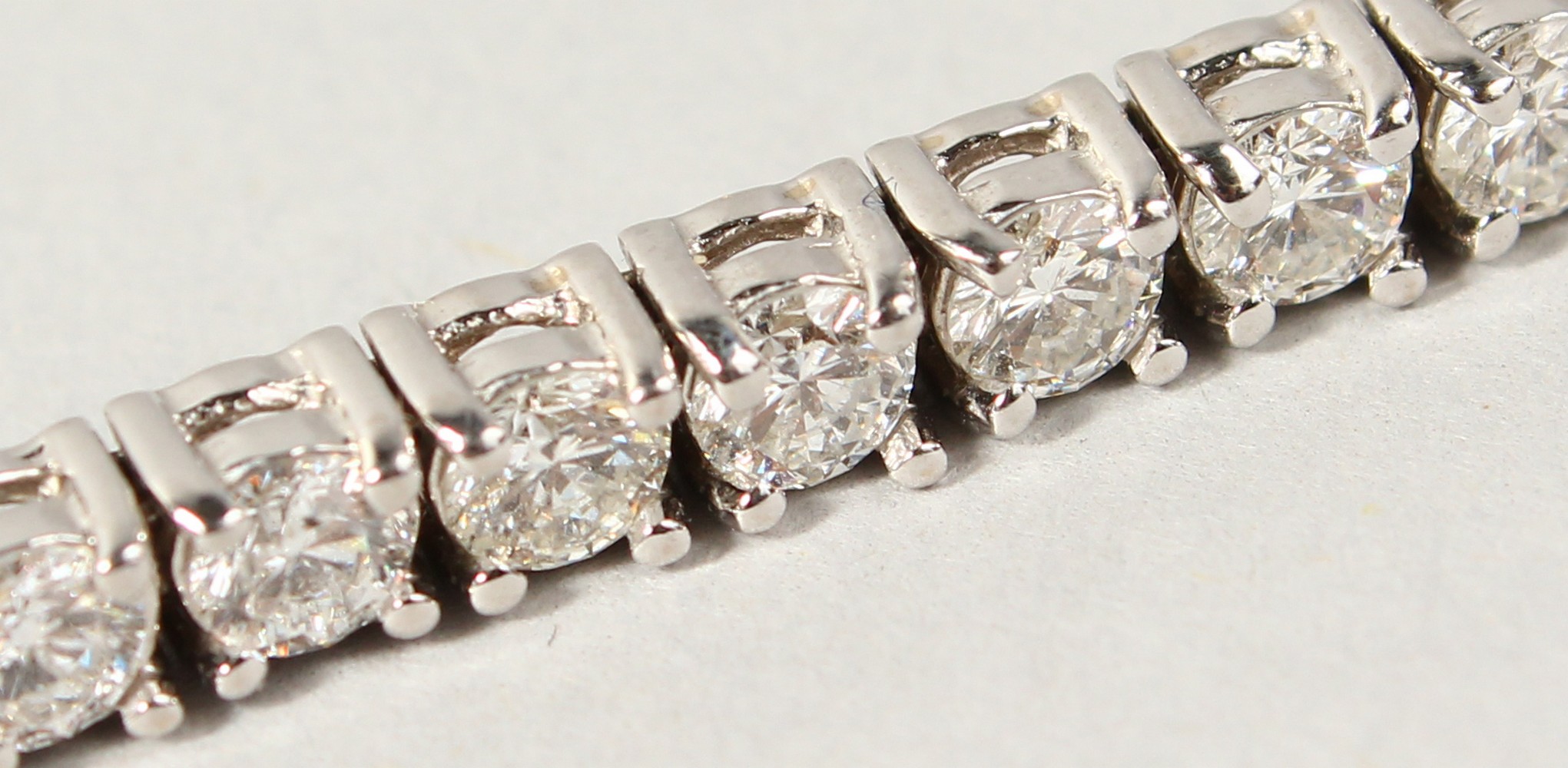 AN 18CT WHITE GOLD DIAMOND LINE BRACELET, with forty-nine diamonds, approx. 6CTS, G/H Colour, V1- - Image 7 of 19