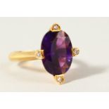 A 14K GOLD, AMETHYST AND DIAMOND RING.